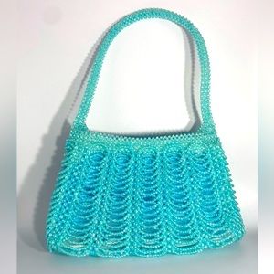 Light blue handbeaded bag